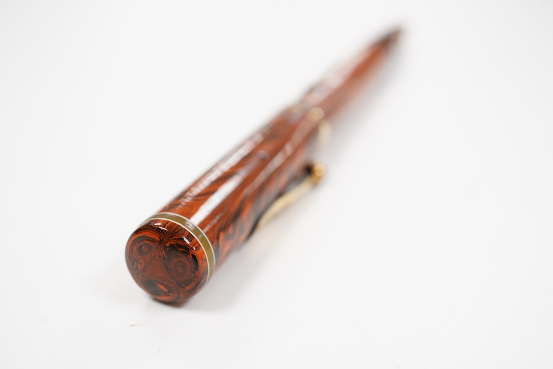 A Waterman Red Ripple No.7 lever filler with yellow cap band and fitted with a Waterman nib